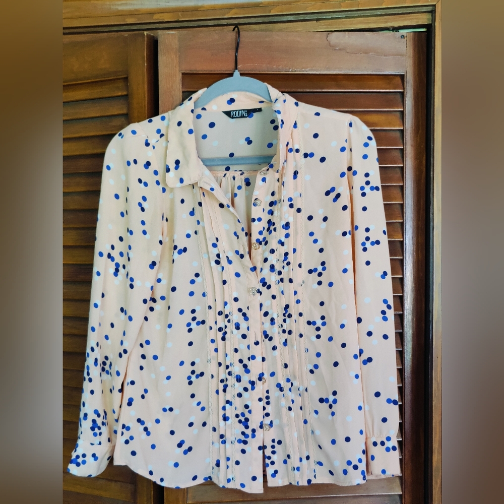 Peach colored blouse by Rodin with polka dots